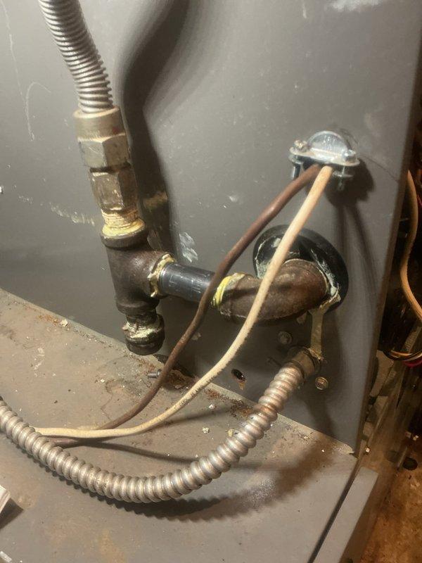 Responded to gas odor complaint originating from fireplace area with occasional smell reported. Conducted comprehensive gas leak inspection of natural gas meter, exterior piping connections, water heater gas supply lines, and fireplace gas valve assembly. Performed leak detection testing using combustible gas detector at all accessible gas connections, joints, and fittings. Inspected water heater gas flex connector, brass fittings, and shut-off valve for integrity and proper installation. Verified gas meter connections and exterior piping showed no signs of leakage following recent utility company meter replacement work. Examined fireplace gas log system and associated gas valve components for potential leak sources. All testing confirmed no active gas leaks detected at time of inspection. System deemed safe for operation with gas supply restored.