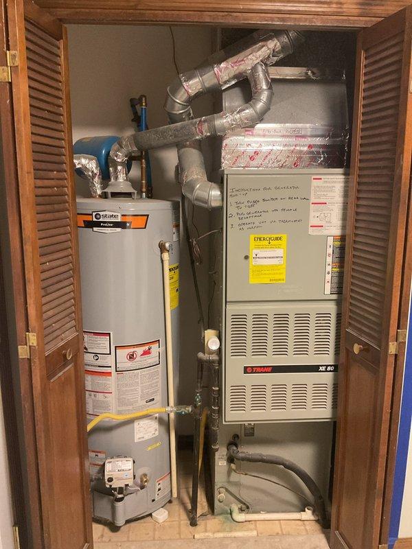 Conducted comprehensive replacement estimate for aging R22 HVAC system with active refrigerant leak. Evaluated existing Trane XE 80 furnace and outdoor heat pump unit for complete system replacement, including air handler upgrade. Assessed ductwork conditions and identified rusted plenum requiring replacement. Discussed proper equipment sizing calculations for residential application and evaluated feasibility of adding additional supply vent to accommodate kitchen remodeling project.