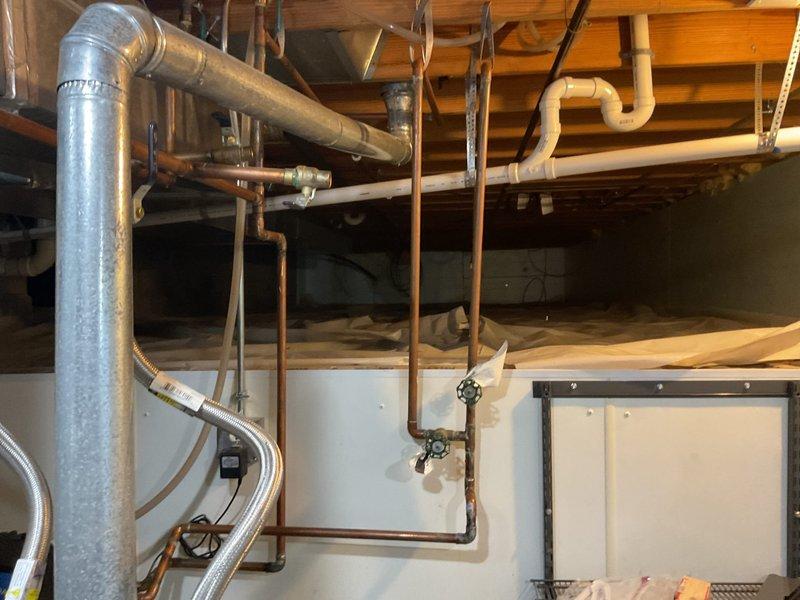 Conducted comprehensive HVAC replacement estimate for homeowner seeking to convert from existing electric furnace system to natural gas heating. Performed thorough assessment of current mechanical systems, ductwork configuration in basement utility area, and exterior electrical service connections to determine requirements for natural gas conversion and complete system replacement. Documented existing infrastructure including ductwork routing, plumbing lines, and electrical service panels to develop appropriate replacement specifications for new natural gas heating system installation.