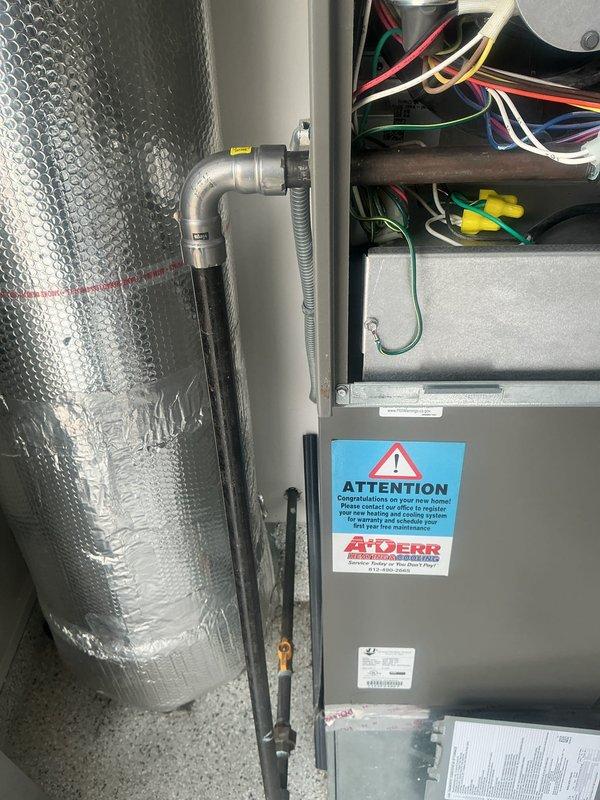 Responded to customer complaint of loud vibrating noise during system startup on 2-year-old HVAC unit located in garage. Upon inspection, diagnosed faulty blower motor and wheel assembly causing abnormal operational sounds. System remained functional but required component replacement to prevent further damage and restore quiet operation. Documented equipment model and serial numbers, photographed air handler installation and mechanical components for parts ordering. Ordered blower motor and wheel assembly for scheduled replacement during customer's requested service window.