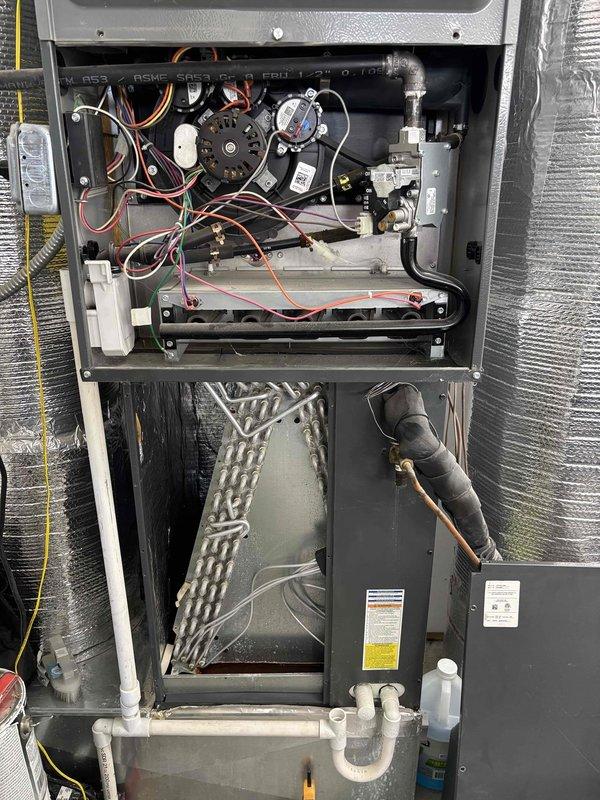 Completed annual Platinum Level maintenance on a 3-year-old single-system HVAC unit during the first scheduled visit. Performed comprehensive system inspection with front panel removed to access internal components, including blower motor assembly, electrical connections, control modules, and heat exchanger. Verified proper operation of all electrical components and wiring harnesses. Conducted diagnostic testing using digital multimeter, recording voltage reading of 430.2V to confirm electrical system performance within manufacturer specifications. Inspected condensate drainage system including PVC piping for proper function. All components found operating within normal parameters with no deficiencies noted.