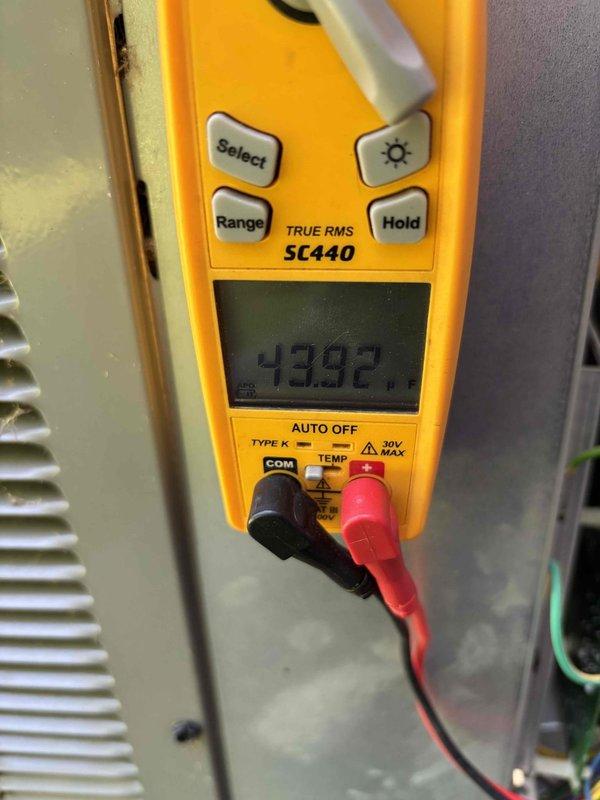Completed annual Platinum Level maintenance on a 3-year-old single-system HVAC unit during the first scheduled visit. Performed comprehensive system inspection with front panel removed to access internal components, including blower motor assembly, electrical connections, control modules, and heat exchanger. Verified proper operation of all electrical components and wiring harnesses. Conducted diagnostic testing using digital multimeter, recording voltage reading of 430.2V to confirm electrical system performance within manufacturer specifications. Inspected condensate drainage system including PVC piping for proper function. All components found operating within normal parameters with no deficiencies noted.