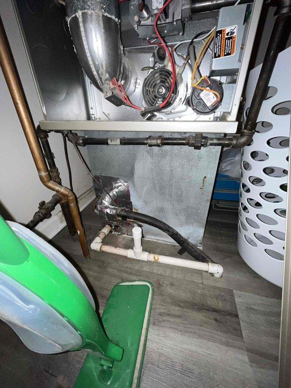 Conducted comprehensive HVAC system evaluation for full replacement estimate at owner-occupied single-family residence. Assessed existing 20-year-old air conditioning system experiencing recurring failures and heating equipment of undetermined age. Documented current system configuration including Honeywell conventional thermostat with standard wiring (R, C, Y, W, G terminals), interior blower assembly, refrigerant line connections, and condensate drainage system. Photographed thermostat wiring schematic and internal mechanical components to determine proper equipment sizing and compatibility requirements for complete system replacement. Provided consultation on whole-house heating and cooling replacement options based on existing infrastructure and equipment condition.