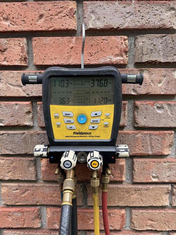 Completed second annual Platinum Level maintenance on 1-year-old HVAC system. Performed comprehensive system inspection including refrigerant pressure and temperature measurements using digital manifold gauges. Verified system operation and documented readings showing temperatures of 110.3°F and 316.8°F at test points. Replaced 20x25x5 air filter as part of routine maintenance protocol. Inspected exterior plumbing connections, valves, and insulated refrigerant lines for proper operation and integrity. All components found in good working condition with no immediate concerns identified. Noted that refrigerant charge verification should be rechecked during warmer ambient conditions for optimal accuracy. Renewed annual maintenance agreement and collected payment for service contract continuation.