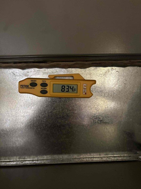 Completed furnace replacement with new Lennox unit installed in utility closet. Verified system operation with temperature readings at 83.4°F and confirmed proper airflow through ductwork connections. Installation tested and operational upon completion.