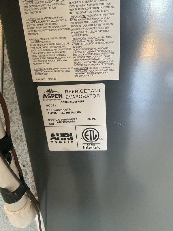 Completed Platinum Level annual maintenance on a 6-year-old single HVAC system with Aspen refrigerant evaporator unit (Model CG800-14-2-45R057) utilizing R-410A refrigerant with TXV installed. Performed comprehensive inspection of equipment located in garage installation alongside water heater. Verified proper operation of evaporator coil assembly, checked refrigerant lines and PVC condensate drainage system, and inspected all visible components including ductwork connections. System operating within normal parameters with design pressure rated at 500 PSI. Filter size confirmed as 24x25x5 for future reference. Equipment labels and safety warnings documented via photographs for service records. All maintenance procedures completed per manufacturer specifications and Platinum Level service protocol.