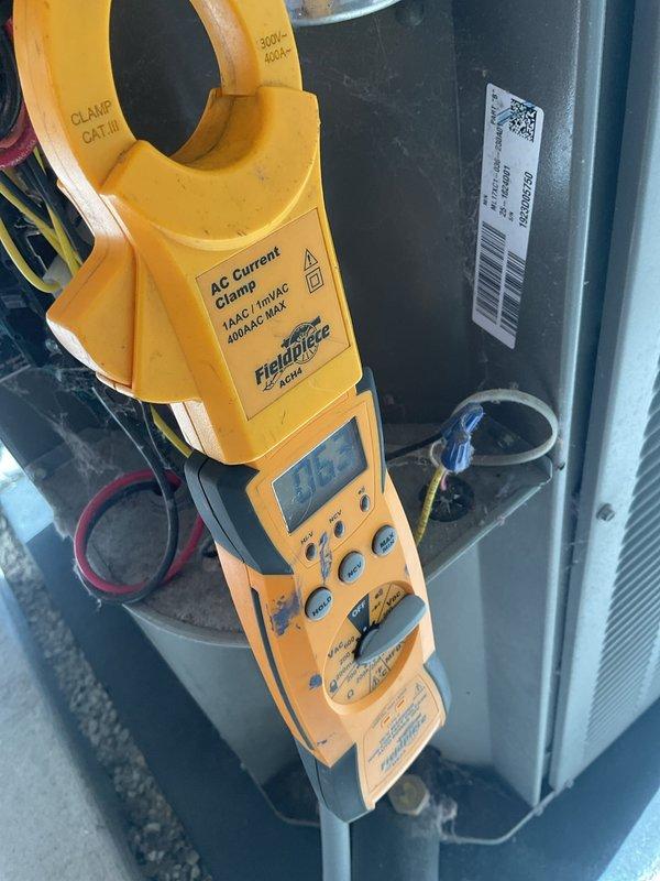 Completed annual planned maintenance visit on HVAC system. Verified thermostat operation showing 73°F on Honeywell Home ProSeries digital unit. Performed electrical diagnostics using clamp meter to measure current draw on outdoor condensing unit, confirming proper amperage levels. System operating within normal parameters with 16x20x5 filters noted at 2 years service life.