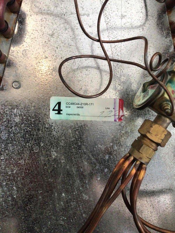 Responded to no-cooling complaint on 4-year-old multi-zone system with no airflow after downstairs zone was turned off. Upon inspection, discovered indoor evaporator coil exhibiting severe corrosion throughout copper coil surfaces, compromising system integrity and performance. Diagnosed failed evaporator coil as root cause of complete system failure. Tagged unit for warranty replacement of indoor evaporator coil and documented conditions with photographs for parts ordering and manufacturer claim processing.