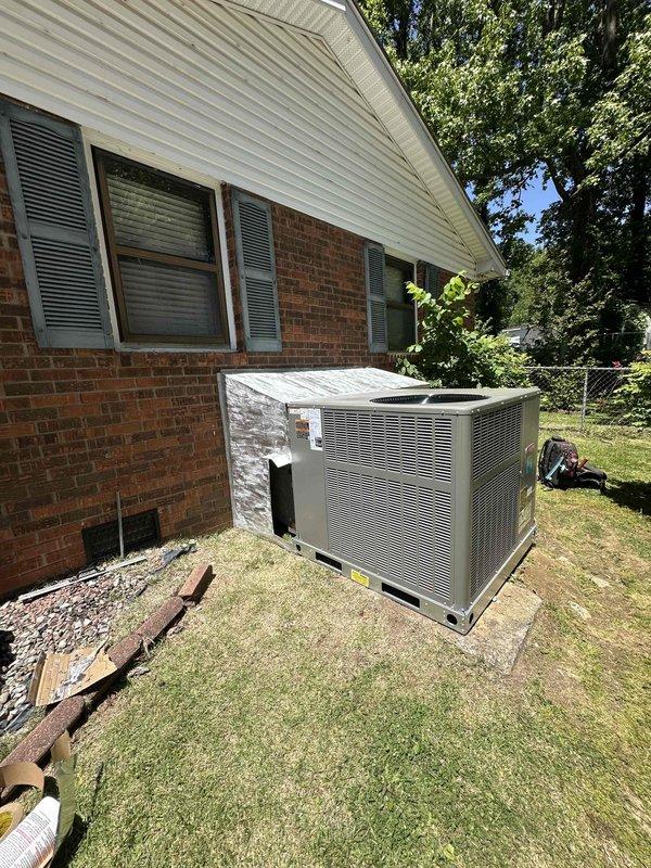 Completed full HVAC system installation consisting of a 2-ton, 14 SEER gas pack unit at residential property. Positioned new equipment on concrete pad adjacent to brick exterior wall, ensuring proper clearances and level placement. Verified all electrical connections, refrigerant lines, and gas supply connections meet manufacturer specifications and local code requirements. System tested and operational upon completion.