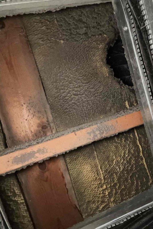 Completed planned maintenance visit on 11-year-old single system residential HVAC unit with SpaceGard 2200 air filtration system. Thermostat verified operational at 71°F room temperature. Inspection revealed significant dust and debris accumulation on air handler components and ductwork requiring attention during future service intervals.