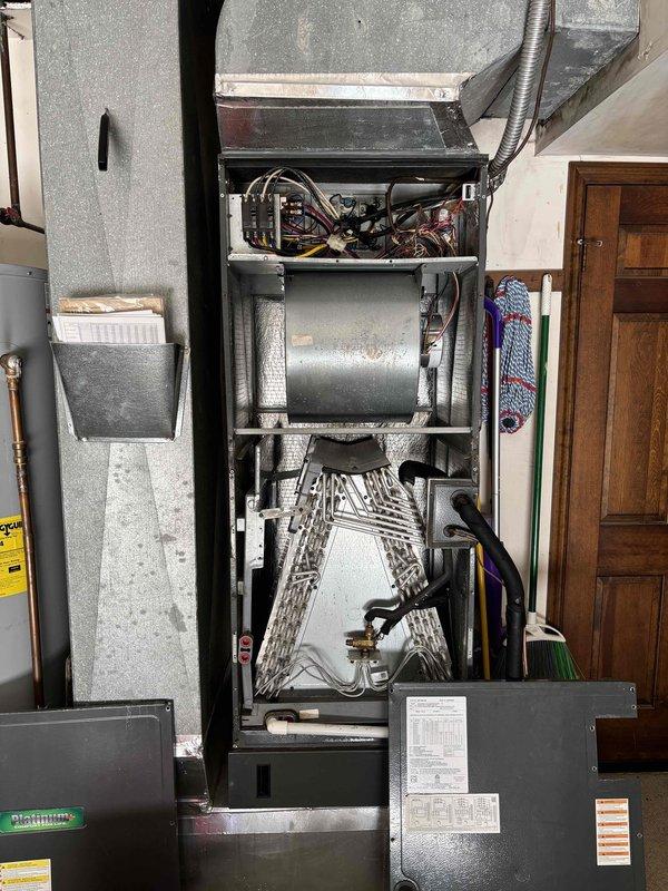 Completed Platinum Level maintenance on a 6-year-old HVAC system during the second scheduled visit of the service agreement. Performed comprehensive inspection of all system components including blower motor assembly, evaporator coil, electrical connections, and control boards. Measured supply and return air temperatures using calibrated digital thermometer to verify proper system operation and temperature differential. Accessed interior cabinet to inspect cylindrical blower motor housing, control compartment wiring, and triangular evaporator coil assembly, which showed clean fins and proper function. Verified condensate drain pan condition and confirmed all electrical connections were secure with no signs of deterioration. Checked ductwork connections and seals for integrity. All components operating within normal parameters with no deficiencies noted. System ready for continued operation. Service agreement due for renewal.