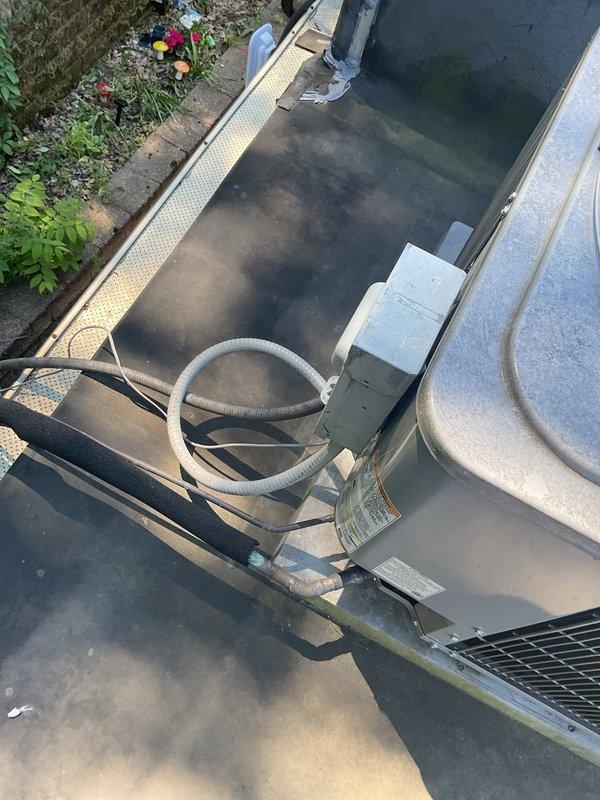 Responded to no cooling complaint on 25-year-old residential air conditioning system with airflow present but inadequate cooling capacity. Performed diagnostic evaluation of rooftop-mounted condenser unit and associated components. Inspected outdoor condensing unit including compressor operation, refrigerant pressures, electrical connections, and heat exchange surfaces. Evaluated indoor airflow delivery and system performance parameters to determine root cause of cooling failure on aging equipment.