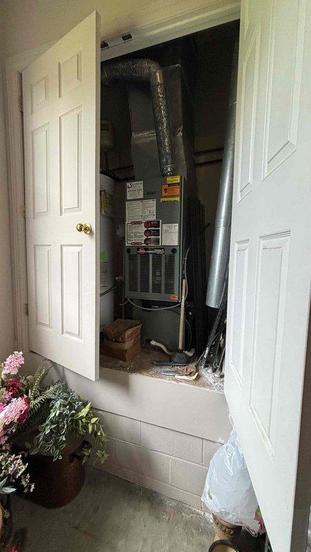 Completed HVAC replacement estimate for non-functioning residential heating system. Assessed existing furnace unit located in interior utility closet with vertical installation and flexible ductwork configuration, evaluated gas meter and supply line accessibility at exterior brick wall location. Provided homeowner with comprehensive replacement options and system specifications during consultation.