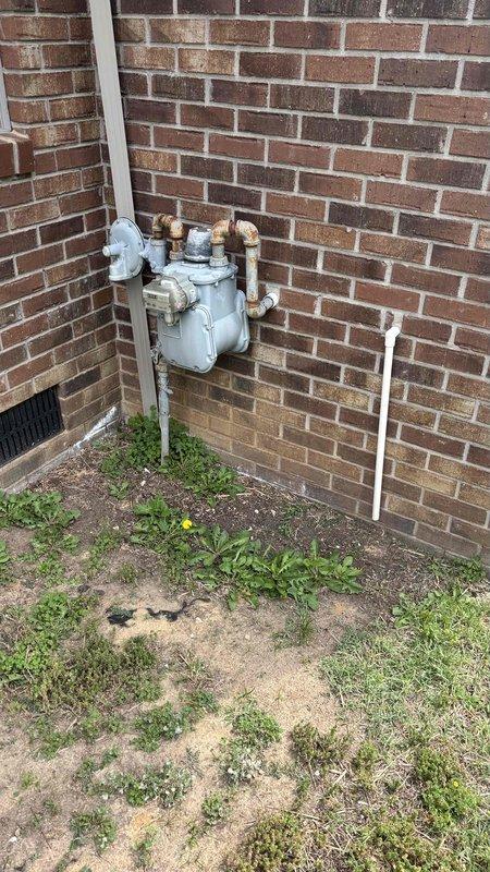 Completed HVAC replacement estimate for non-functioning residential heating system. Assessed existing furnace unit located in interior utility closet with vertical installation and flexible ductwork configuration, evaluated gas meter and supply line accessibility at exterior brick wall location. Provided homeowner with comprehensive replacement options and system specifications during consultation.