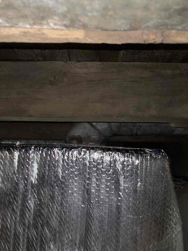 Responded to service call for inadequate cooling capacity in residential property. Upon inspection, confirmed existing HVAC system is undersized for the total square footage requiring conditioned air distribution. Evaluated air handler, ductwork configuration, and attic insulation conditions. Documented current equipment specifications and spatial limitations. Discussed system capacity requirements and replacement options with homeowner to properly address cooling deficiencies throughout the living space.