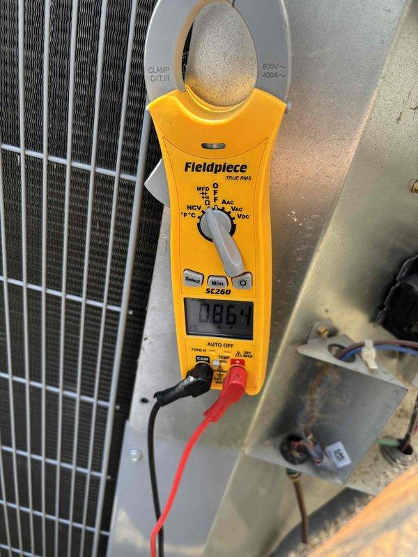 Responded to no cooling complaint on 5-year-old residential air conditioning system. Upon arrival, performed diagnostic testing and identified failed run capacitor preventing compressor operation. Measured capacitance values using field meter, confirming capacitor was out of specification and required immediate replacement. Installed new JARD brand dual run capacitor with proper ratings, verified electrical connections, and tested system operation. Unit restored to full cooling capacity with compressor and condenser fan motor operating within normal parameters.