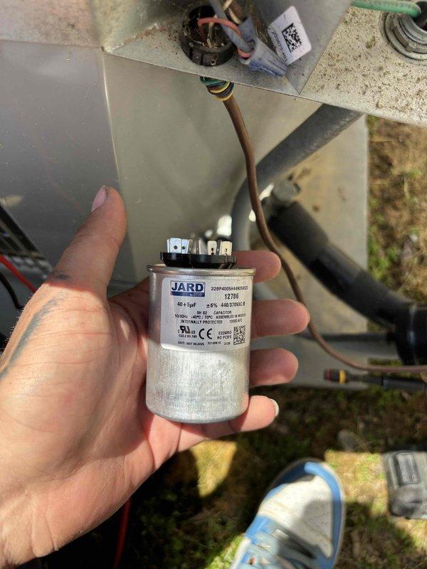 Responded to no cooling complaint on 5-year-old residential air conditioning system. Upon arrival, performed diagnostic testing and identified failed run capacitor preventing compressor operation. Measured capacitance values using field meter, confirming capacitor was out of specification and required immediate replacement. Installed new JARD brand dual run capacitor with proper ratings, verified electrical connections, and tested system operation. Unit restored to full cooling capacity with compressor and condenser fan motor operating within normal parameters.