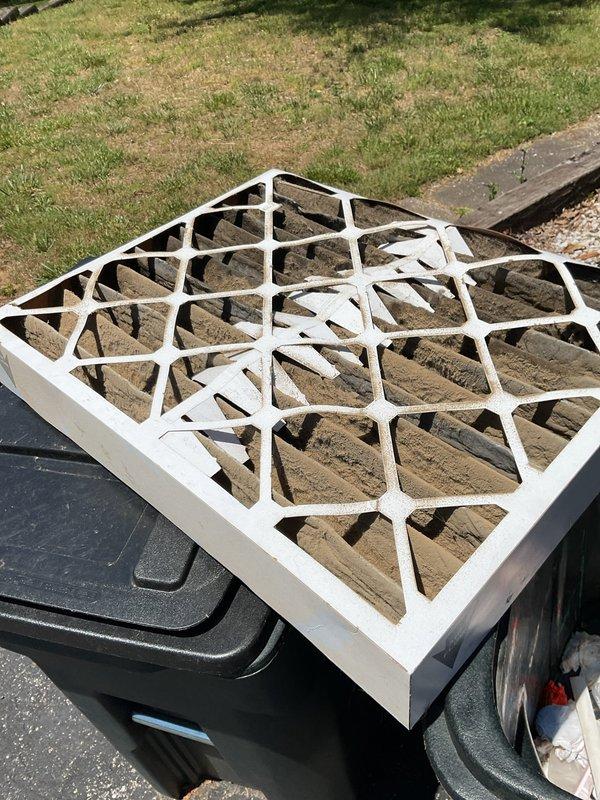 Responded to no cooling complaint on 5-year-old system with history of recurring refrigerant loss over the past couple years. Upon arrival, homeowner had turned system off due to inadequate cooling. Performed diagnostic evaluation on Goodman condenser unit model BA1A42GJJAA (manufactured 05/2021) and found heavily soiled air filter restricting airflow, which was documented and replaced. System was running at time of inspection with airflow present at registers and no ice formation on indoor coil. Given the reported pattern of repeated low refrigerant issues, recommended further leak detection and refrigerant charge verification to address underlying cause of cooling deficiency.