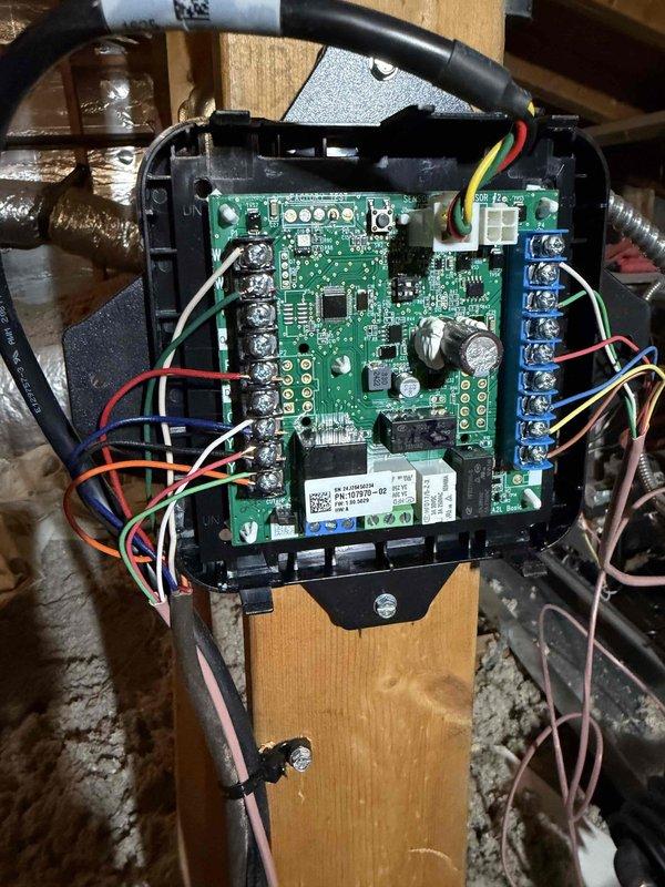 Completed installation of a 4-ton, 17 SEER split system with 80% AFUE upflow furnace in residential attic space. Mounted air handler unit on attic floor with proper clearances and secured all ductwork connections. Installed new control board with proper wiring connections including power, thermostat, and safety circuits using color-coded wiring to terminal blocks. Routed flexible ductwork throughout attic space to supply registers, ensuring proper support and insulation wrap on all duct runs. Verified all electrical connections at control board, tested system operation, and confirmed proper airflow through distribution system.