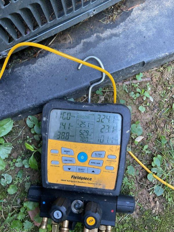 Responded to callback for system not maintaining setpoint temperature, with indoor temperature reading 78°F while thermostat set to 67°F. Upon arrival, performed diagnostic testing of outdoor condensing unit using digital manifold gauges to measure refrigerant pressures and temperatures. System evaluation revealed inadequate cooling capacity despite recent maintenance performed on 5/11. Documented current operating conditions with refrigerant line connections showing age-related deterioration and outdoor unit exhibiting weathering on cabinet and components. Measured superheat and subcooling values to assess refrigerant charge and system performance. Equipment inspection identified potential airflow or refrigerant charge issues requiring further corrective action to restore proper cooling operation and achieve desired indoor temperature.