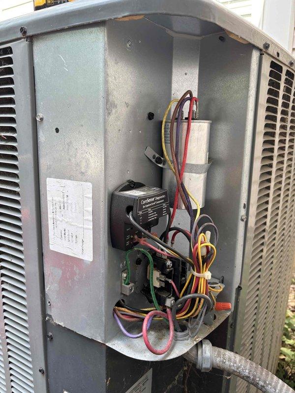 Completed second annual planned maintenance visit on 9-year-old HVAC system. Performed comprehensive system inspection including temperature diagnostics of ductwork, reading 58°F at measurement point. Accessed outdoor condensing unit electrical compartment and inspected all internal components including CondeSet Saver hard start device, capacitor, and associated wiring connections. All electrical connections secured with proper wire management and zip ties in place. Verified system operational parameters and documented conditions with diagnostic photography. System requires service agreement renewal. Filter size for future reference: 20x25x5.