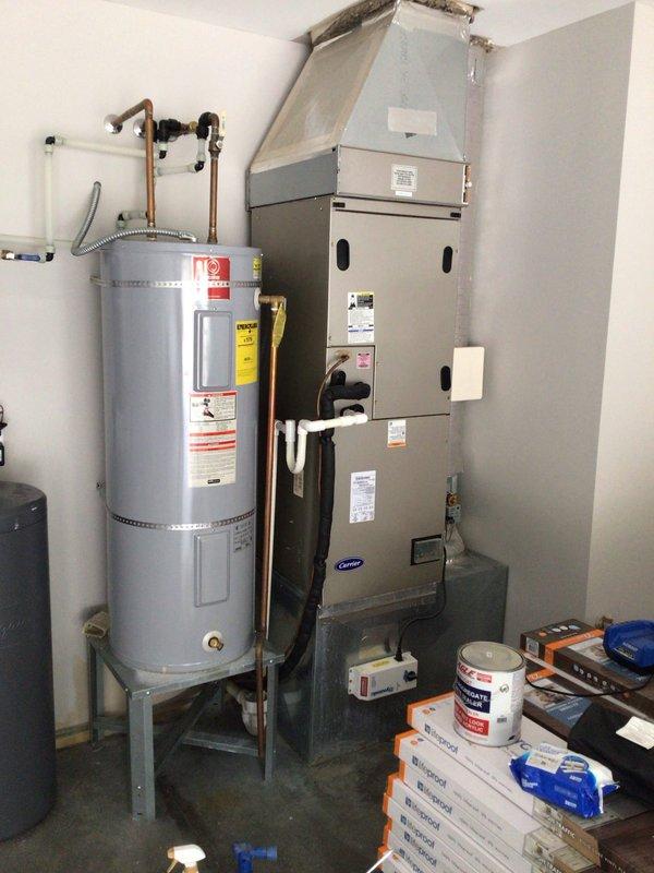 Responded to no cooling complaint on 12-year-old Carrier system where blower was operational but unit failed to produce cool air. Upon inspection, discovered outdoor condenser unit not running due to failed compressor and associated electrical issues, evidenced by significant corrosion on refrigerant lines, accumulator, and condenser components. System showed signs of age-related deterioration including rust staining on cabinet panels and oxidation on copper refrigerant piping connections. Performed diagnostic testing to confirm compressor failure and assessed overall system condition, noting indoor air handler unit in utility room remained functional with adequate airflow through vents.