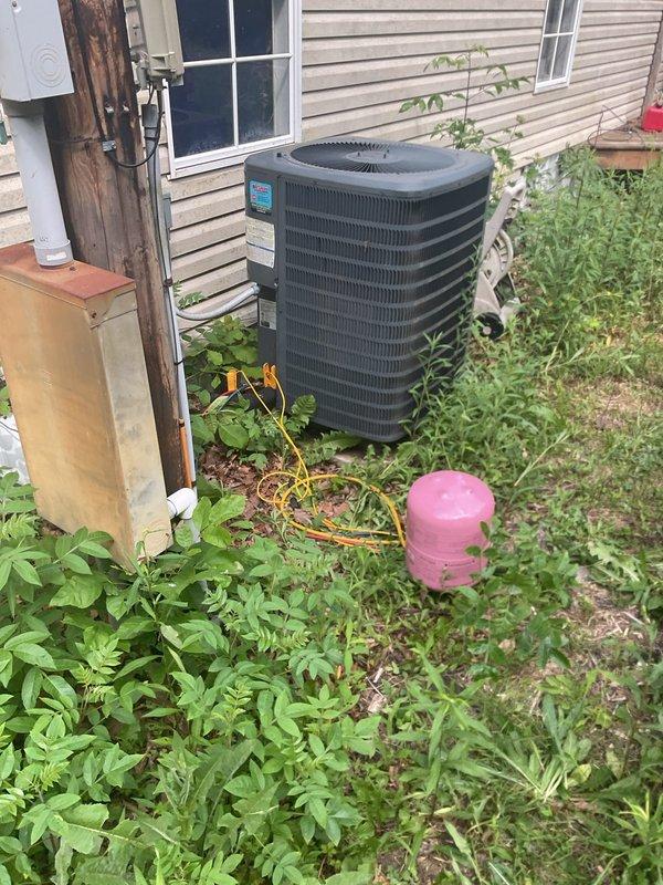 Responded to no cooling call on 7-year-old residential HVAC system with frozen evaporator coil. System was shut down to allow complete thawing of ice buildup on A-frame copper coil assembly. Connected gauges to outdoor condenser unit to verify refrigerant pressures and system operation once defrost cycle completed, ensuring proper airflow restoration through the air handler and return to normal cooling function.