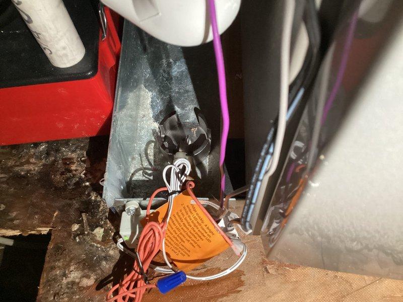 Responded to emergency water leak call for upstairs HVAC system (2 years old) actively dripping onto kitchen counters below. Upon inspection, discovered significant condensation accumulation on air handler drain pan and associated components in attic mechanical space. Identified clogged condensate drain line preventing proper drainage, causing overflow condition. Cleared blockage from primary drain line using appropriate tools and verified proper flow. Inspected secondary drain pan for damage and confirmed structural integrity. Tested system operation and monitored drain function to ensure leak was resolved. Documented moisture damage on kitchen ceiling showing visible crack along wall junction from water intrusion. Advised homeowner to monitor affected drywall area for further deterioration and recommended follow-up with contractor for cosmetic ceiling repairs once area fully dries. System returned to normal operation with proper condensate drainage restored.