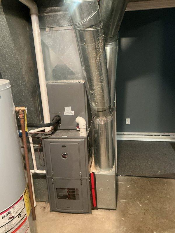 Responded to no cooling call on approximately 10-year-old residential HVAC system with thermostat set to 72°F but indoor temperature reading 80°F. Upon arrival, confirmed adequate airflow through supply vents with blower operational and no ice buildup present at indoor coil. Performed diagnostic evaluation of outdoor condensing unit located beneath deck structure and indoor air handler/furnace system in basement. Identified cooling system deficiency preventing proper temperature satisfaction. Completed necessary repairs to restore cooling capacity and verified system operation with proper airflow and refrigerant cycle functionality. System returned to normal cooling operation with thermostat achieving setpoint.