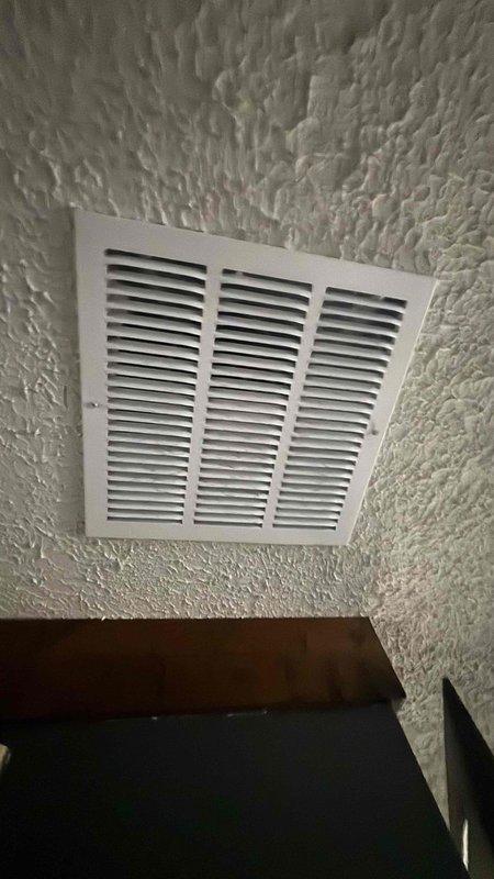 Completed comprehensive HVAC replacement estimate for air conditioning system at residential property. Evaluated existing furnace and air handler configuration in basement utility area, assessed ductwork and air return system, and documented current equipment specifications including gas line connections, PVC condensate drainage, and plenum installation. Provided homeowner with detailed replacement options for AC unit only, as existing furnace remains operational.