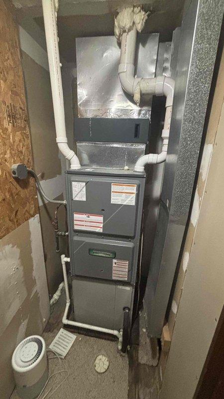 Completed comprehensive HVAC replacement estimate for air conditioning system at residential property. Evaluated existing furnace and air handler configuration in basement utility area, assessed ductwork and air return system, and documented current equipment specifications including gas line connections, PVC condensate drainage, and plenum installation. Provided homeowner with detailed replacement options for AC unit only, as existing furnace remains operational.