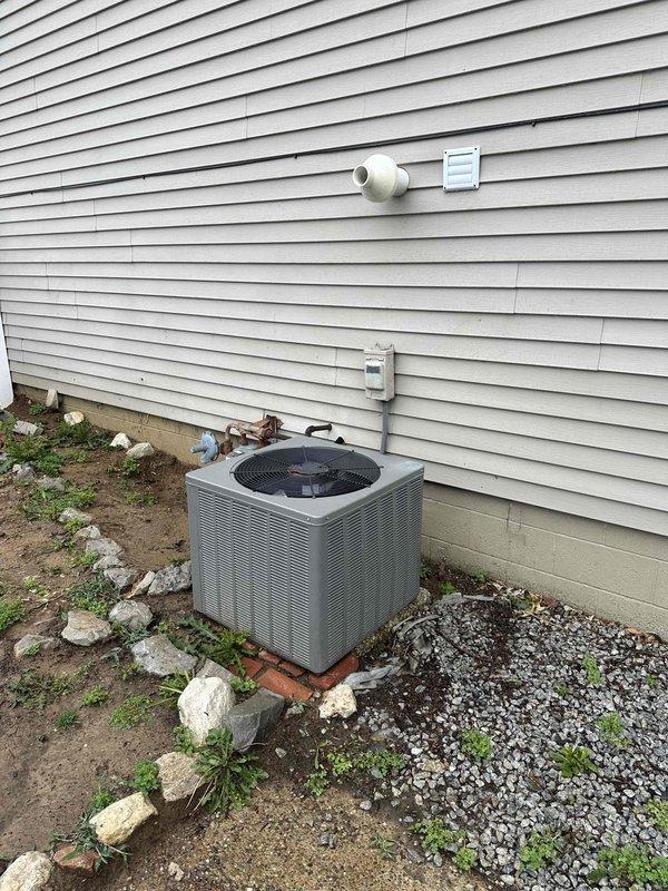 Responded to follow-up service call for 15-year-old system previously experiencing freezing issues. Upon arrival, system was blowing warm air and not maintaining setpoint, with thermostat reading 76°F while set to 70°F. Verified no breaker trips or visible ice buildup on evaporator coil. Performed refrigerant charge verification on outdoor condensing unit and indoor air handler. Checked system pressures, superheat, and subcooling values to ensure proper refrigerant levels following previous defrost. System operating within manufacturer specifications after charge confirmation.