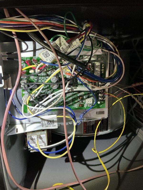 Completed planned maintenance on first of two HVAC systems at property. Performed comprehensive inspection of control board assembly, verified all electrical connections and wiring harness integrity, and documented system components including multi-stage circuit boards and power supply. Inspected attic-mounted air handler unit, checked refrigerant lines and ductwork connections, and replaced 16x25x5 air filter. System operating within normal parameters with all safety labels and manufacturer specifications verified.