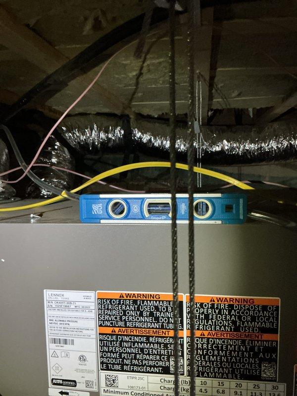 Completed planned maintenance on first of two HVAC systems at property. Performed comprehensive inspection of control board assembly, verified all electrical connections and wiring harness integrity, and documented system components including multi-stage circuit boards and power supply. Inspected attic-mounted air handler unit, checked refrigerant lines and ductwork connections, and replaced 16x25x5 air filter. System operating within normal parameters with all safety labels and manufacturer specifications verified.