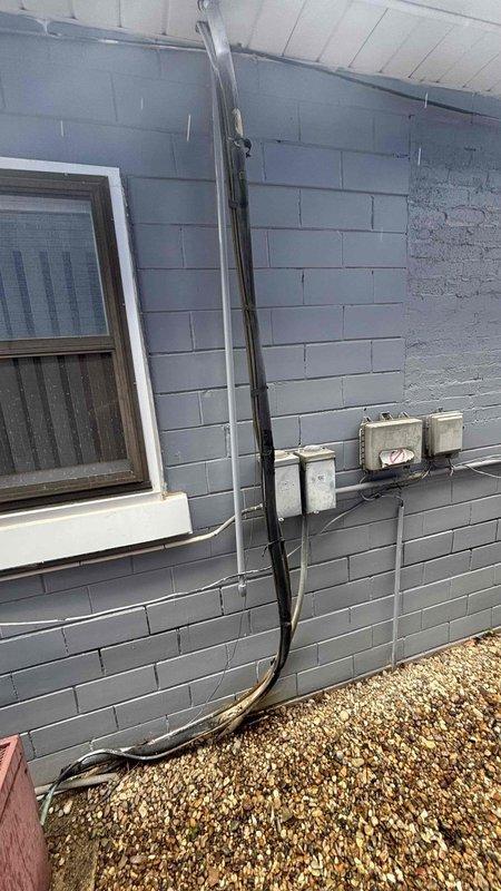 Performed comprehensive HVAC system replacement estimate for attic-mounted unit experiencing heating failure since March and inadequate cooling performance with 2-degree temperature differential. Assessed existing refrigerant line set routed along exterior concrete block wall showing signs of weathering and age. Evaluated attic access point through drop ceiling and documented current system configuration to provide complete replacement options for failed heating and cooling equipment.