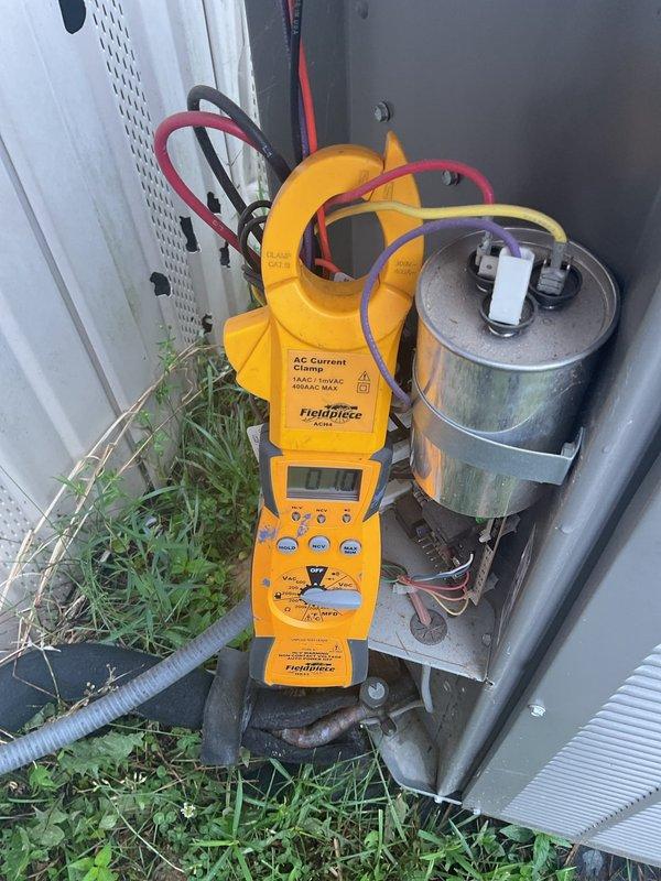 Completed scheduled air conditioning tune-up and preventive maintenance service. Verified thermostat operation and temperature settings, performed electrical diagnostics on outdoor condensing unit including amperage measurements and capacitor testing. All system components found operating within normal parameters.