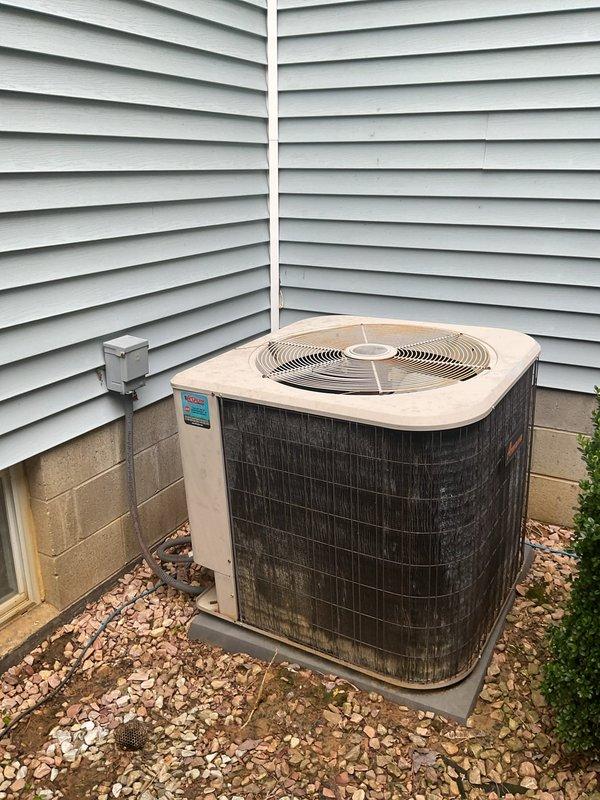 Conducted comprehensive HVAC system replacement estimate for existing residential air conditioning system. Evaluated outdoor condenser unit showing age-related wear and exterior discoloration, assessed electrical disconnect and associated wiring, and inspected Jackson Systems control panel for compatibility with replacement equipment options. Documented current system configuration and provided homeowner with equipment replacement recommendations to improve efficiency and reliability.