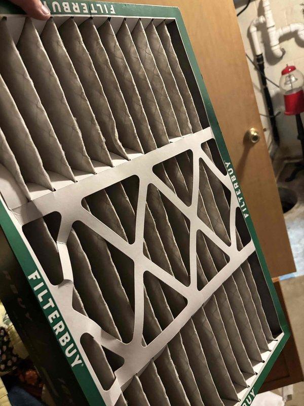 Completed annual Gold Level maintenance on 10-year-old HVAC system for new maintenance member. Installed new FILTERBUY pleated air filter and performed comprehensive system inspection with temperature differential readings measuring 54.6 degrees, confirming proper system operation and airflow efficiency.