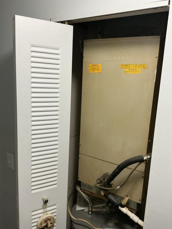 Responded to no cooling complaint at residential property. Upon arrival, accessed HVAC system located in interior utility closet. Inspected air handler unit and verified thermostat settings. Found system was not set to cooling mode as reported. Adjusted thermostat to cooling mode and verified proper system operation. Unit began cooling cycle normally with appropriate temperature differential. Confirmed airflow through supply registers and proper compressor operation. No mechanical defects or refrigerant issues identified. Educated occupant on proper thermostat operation for cooling mode.