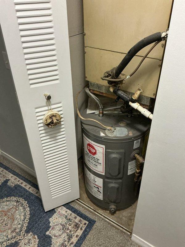 Responded to no cooling complaint at residential property. Upon arrival, accessed HVAC system located in interior utility closet. Inspected air handler unit and verified thermostat settings. Found system was not set to cooling mode as reported. Adjusted thermostat to cooling mode and verified proper system operation. Unit began cooling cycle normally with appropriate temperature differential. Confirmed airflow through supply registers and proper compressor operation. No mechanical defects or refrigerant issues identified. Educated occupant on proper thermostat operation for cooling mode.
