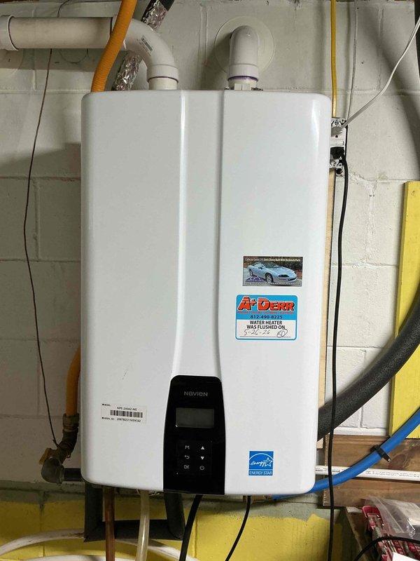 Performed scheduled maintenance flush on Navien tankless water heater per customer's requested appointment time. Completed descaling procedure using flush kit with cleaning solution to remove mineral buildup from heat exchanger, ensuring optimal unit performance and efficiency. Applied service sticker documenting maintenance completion date. Unit tested and operating within normal parameters upon service completion.