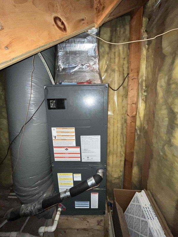 Completed comprehensive HVAC replacement estimate for residential system experiencing refrigerant leak. Evaluated existing air handler unit located in attic space and assessed exterior condensing unit with associated refrigerant lines and electrical conduit mounted to building exterior. Documented current system configuration including ductwork connections, condensate drainage, and electrical service to provide accurate replacement specifications and equipment sizing recommendations.