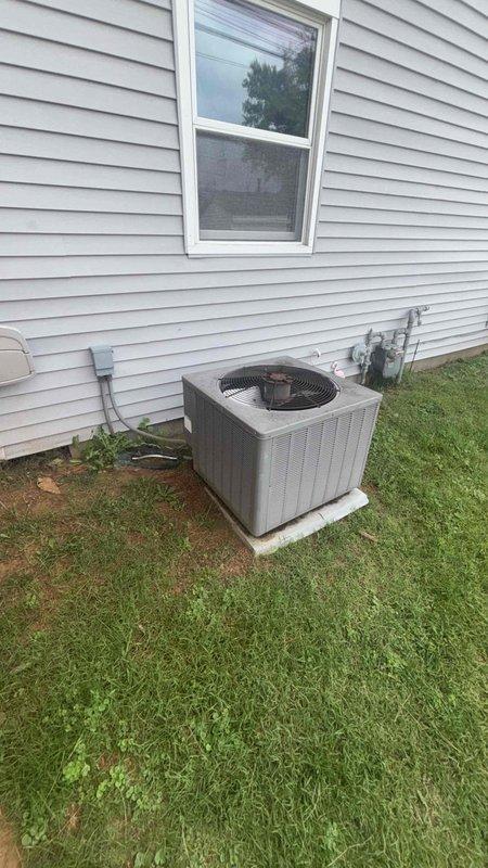 Conducted comprehensive evaluation of existing HVAC system for complete heating and cooling replacement estimate. Assessed 64-year-old furnace and air conditioning units dating from approximately 1962. Documented outdoor condenser unit condition, electrical disconnect, and mounting configuration on concrete pad. Performed interior inspection including ductwork measurements and system component assessment. Photographed existing equipment placement, electrical connections, and duct dimensions to determine proper sizing requirements for replacement system. Provided detailed replacement recommendations for both heating and air conditioning equipment to modernize home comfort system.