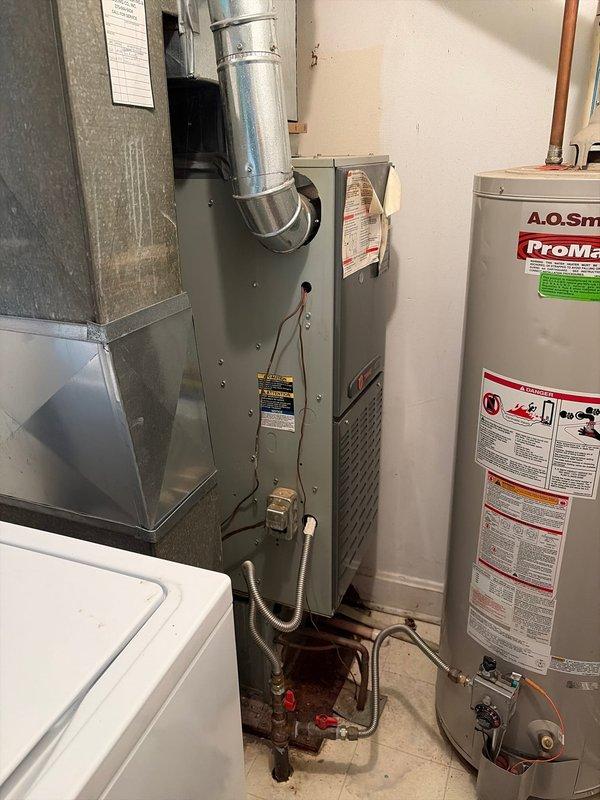 Responded to no cooling call on residential system aged 5-10 years. Upon arrival, verified system would not respond to thermostat calls for cooling, though unit could be manually forced on at equipment. Confirmed thermostat had been recently replaced by homeowner with issue persisting. Performed diagnostic evaluation of thermostat wiring and control circuit between indoor air handler and outdoor condensing unit. Identified faulty low-voltage wiring connection and control board communication failure preventing proper thermostat signal transmission. Repaired wiring connections, tested control board functionality, and restored proper communication between thermostat and HVAC equipment. Cycled system through multiple cooling calls to verify proper operation. System now responding correctly to thermostat commands with outdoor unit engaging on demand and delivering conditioned air through ductwork.