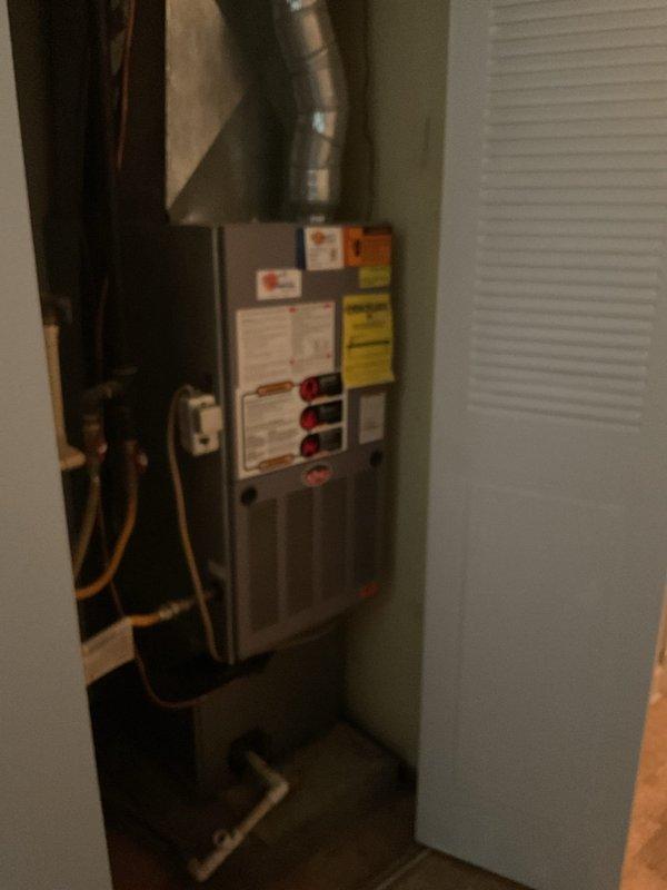 Conducted comprehensive HVAC system replacement estimate for non-operational residential heating and cooling equipment. Evaluated existing furnace/air handler unit located in interior mechanical closet and outdoor condensing unit positioned on exterior concrete pad against brick foundation. Assessed current system configuration including ductwork connections, refrigerant line routing, electrical service requirements, and overall installation conditions to provide homeowner with replacement options and specifications for new equipment installation.