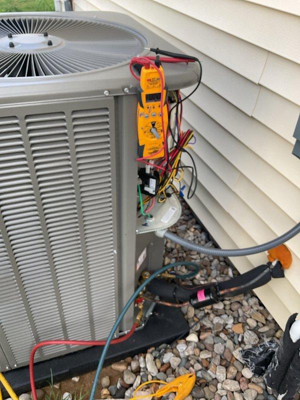 Completed Platinum Level planned maintenance on a 4-month-old single-system HVAC unit during the first annual visit. Performed comprehensive system diagnostics using digital multimeter on outdoor condensing unit, verified thermostat operation and calibration with unit displaying 76°F setpoint, and replaced 16x25x4 air filter. Conducted electrical testing with multi-lead connections to assess compressor performance, capacitor functionality, and overall system efficiency. Inspected refrigerant lines, conduit connections, and exterior unit condition. All components operating within manufacturer specifications with no issues identified during this initial scheduled maintenance visit.