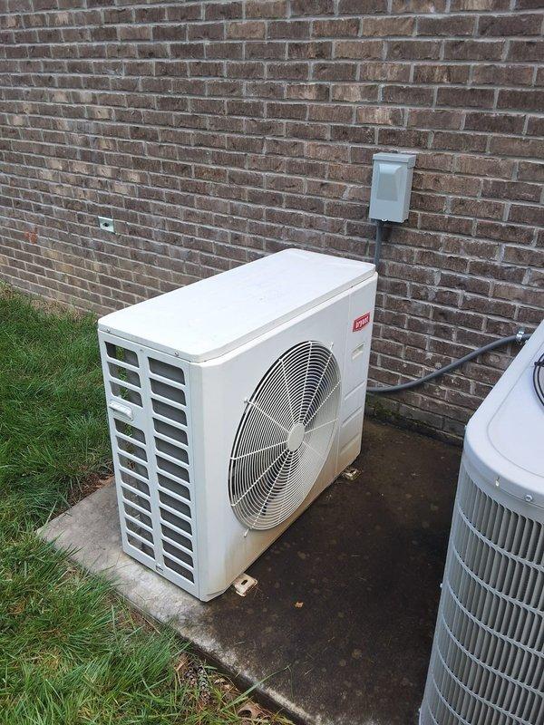 Responded to no-cooling complaint on 8-year-old ductless mini-split system with indoor unit blowing warm air and outdoor condenser fan not operating. Performed diagnostic inspection of both indoor wall-mounted evaporator unit and outdoor heat pump condenser. Confirmed outdoor fan motor failure preventing heat rejection and causing loss of cooling capacity. Verified electrical connections at disconnect box, checked control board signals, and tested capacitor and fan motor operation. Indoor unit blower functioning properly but system unable to cool due to non-operational outdoor fan assembly requiring replacement to restore normal cooling operation.