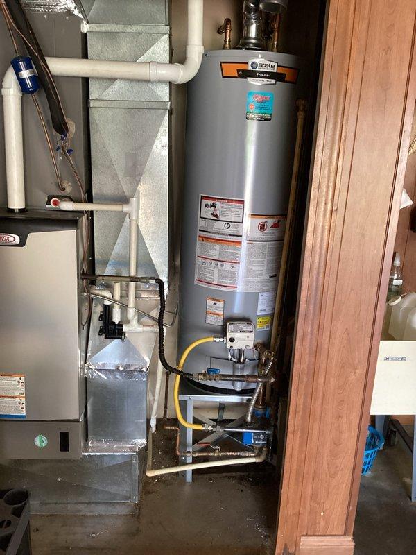 Installed a 50-gallon State Water Heaters ProLine commercial-grade water heater in utility room with complete plumbing connections, gas line hookup, and proper venting. Unit includes 6-year parts warranty and 1-year labor warranty, with all connections secured to code and system tested for proper operation.