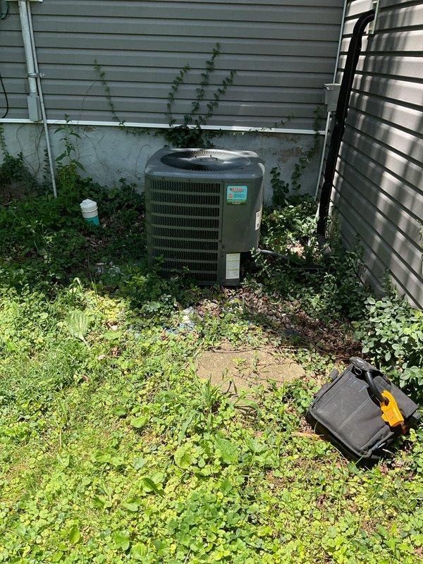 Responded to no cooling complaint on 6-year-old residential air conditioning system with adequate airflow but insufficient cooling. Upon inspection of outdoor condensing unit, diagnosed failed dual-run capacitor preventing compressor from operating properly. Replaced defective capacitor with OEM-equivalent component, verified proper voltage and amperage readings, and tested system operation. Unit now cooling effectively with compressor and condenser fan motor running within manufacturer specifications. Performed complete maintenance service including coil cleaning, refrigerant charge verification, and electrical connection inspection. Advised property owner to maintain clearance around outdoor unit due to excessive vegetation growth observed during service.