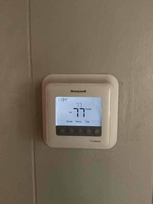 Completed scheduled HVAC maintenance on Goodman model A5X18031TAB outdoor condensing unit operating at 208-230V. Performed comprehensive system tune-up including inspection of compressor, condenser coil, fan motor operation, and electrical connections. Verified proper refrigerant pressures and system performance. Checked Honeywell ProSeries thermostat functionality, confirmed accurate temperature readings and cooling mode operation. Unit showed normal outdoor weathering consistent with exterior installation; all components operating within manufacturer specifications upon completion of maintenance.